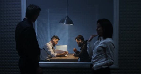 调查人员审讯犯罪嫌疑人影片素材 Investigators Watching an Interrogation